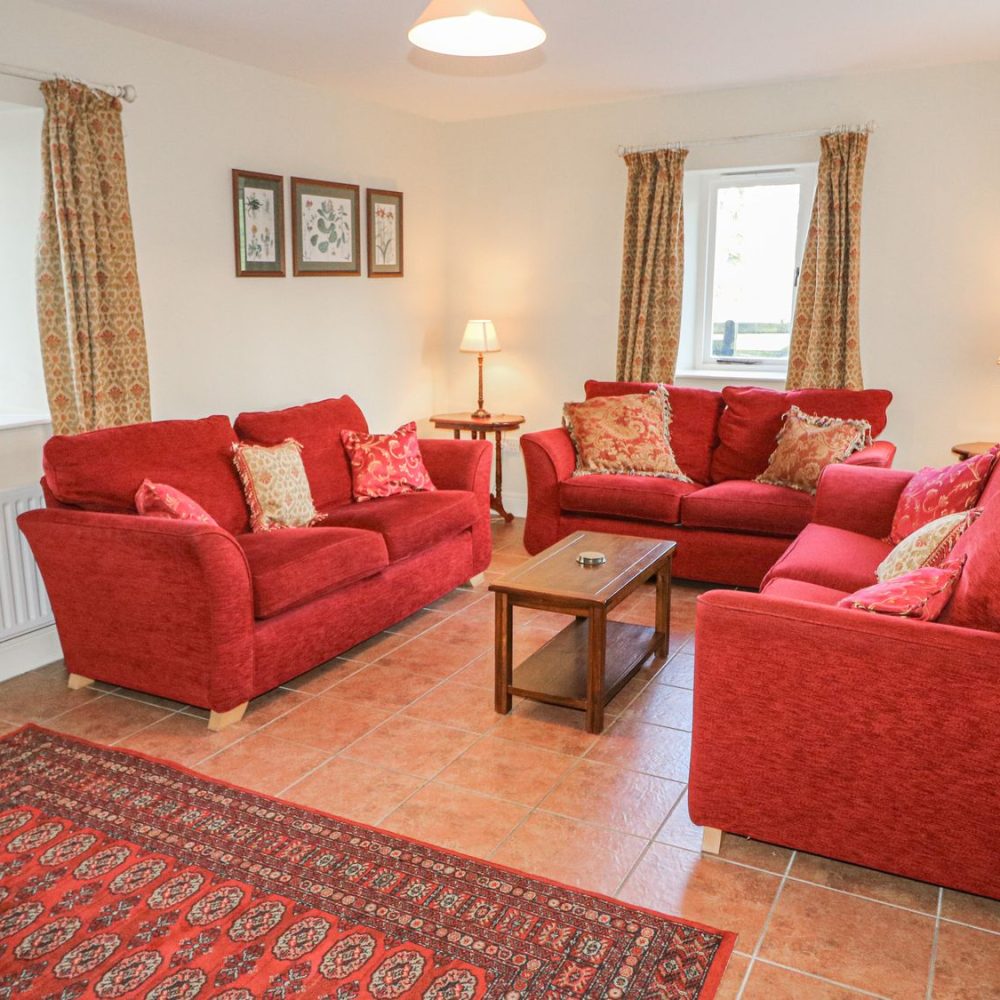 Spacious sitting room with open fire, Goose Cottage
